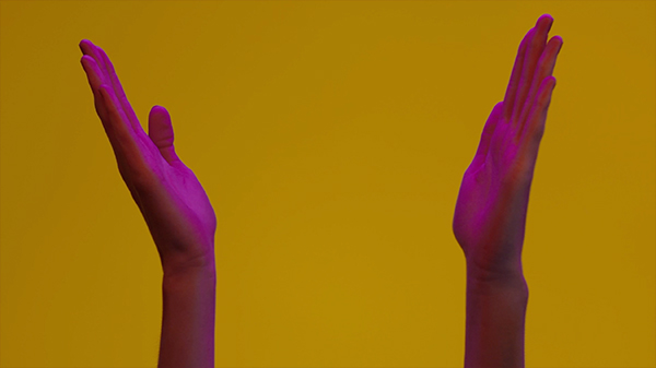 Hand clap in yellow background