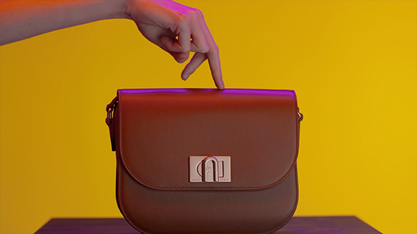 finger walk on a Furla bag